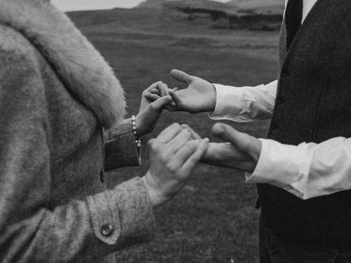 Monochrome Photo Of People Holding Hands
